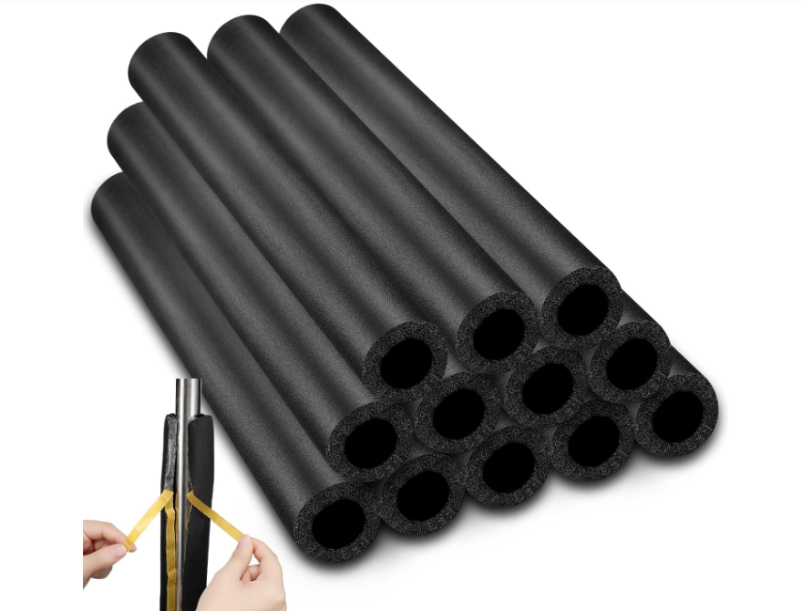 Rigid pipe insulation tubes installed on piping systems providing thermal insulation and condensation control for HVAC and industrial applications