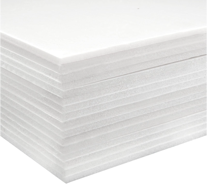 Stacked white styrofoam insulation sheets made of expanded polystyrene used for thermal insulation in construction